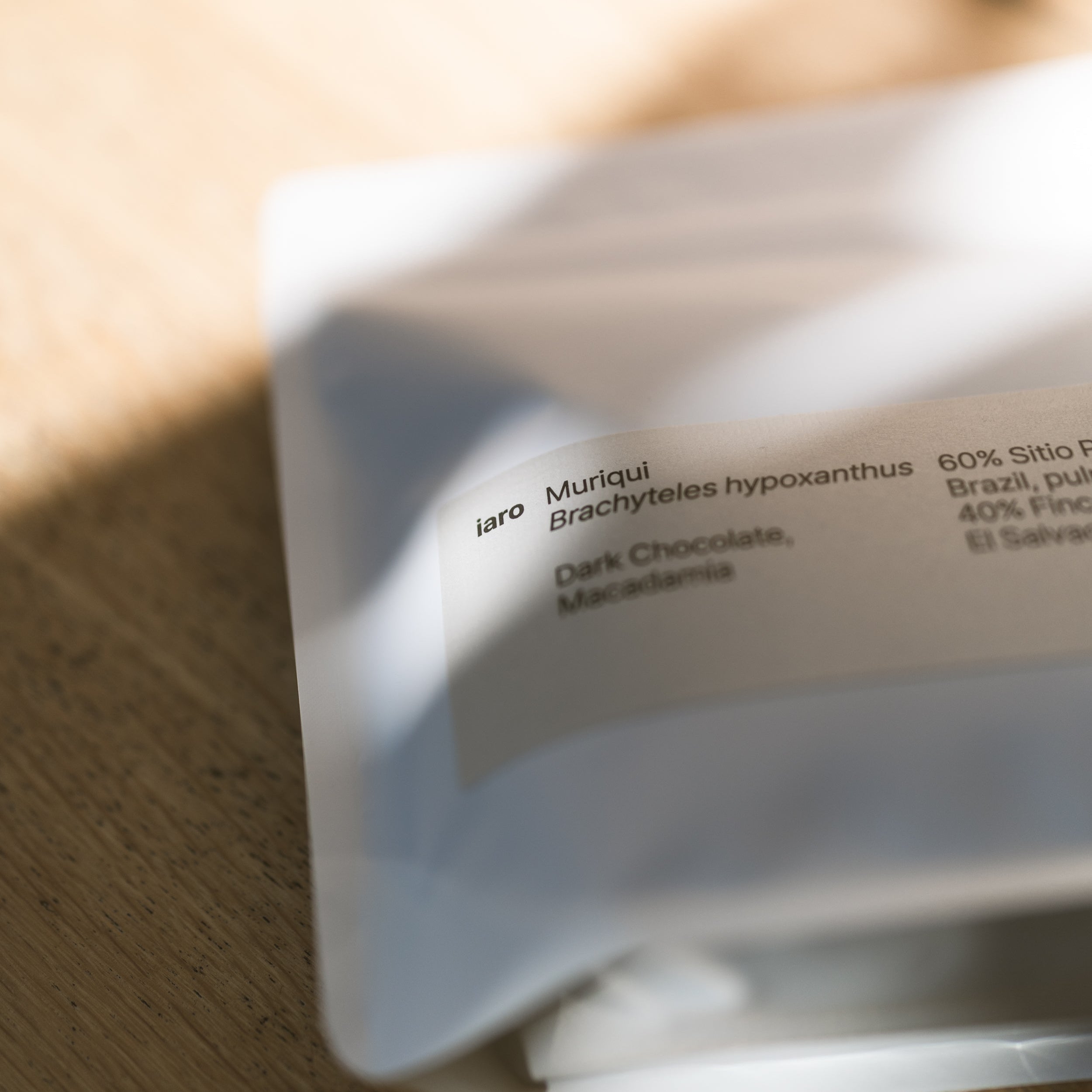 A bag of speciatly coffee named muriqui lying in the sun.