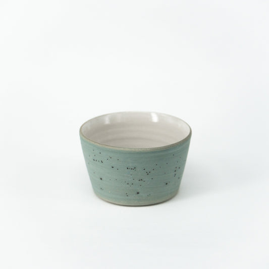 iaro specialty coffee cup (size S for espresso, cortado and magic) in blue-grey in front of a neutral white backround.